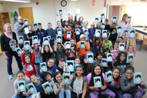 Chamisa 5th graders hold up copies of the book Wonder