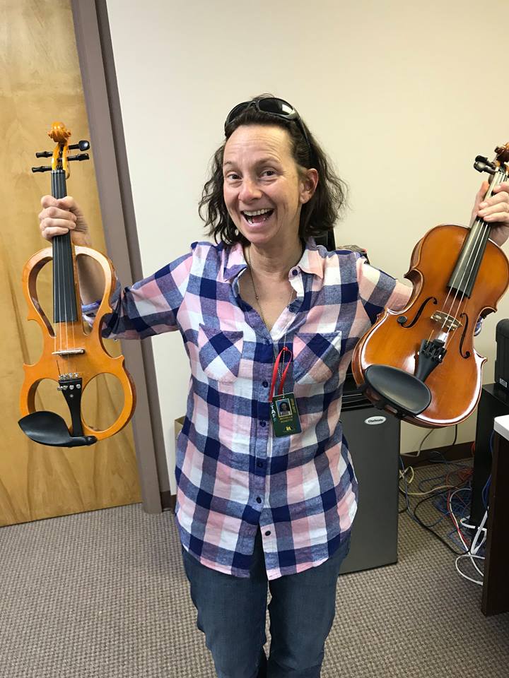 Ms. Rosette with donated violins